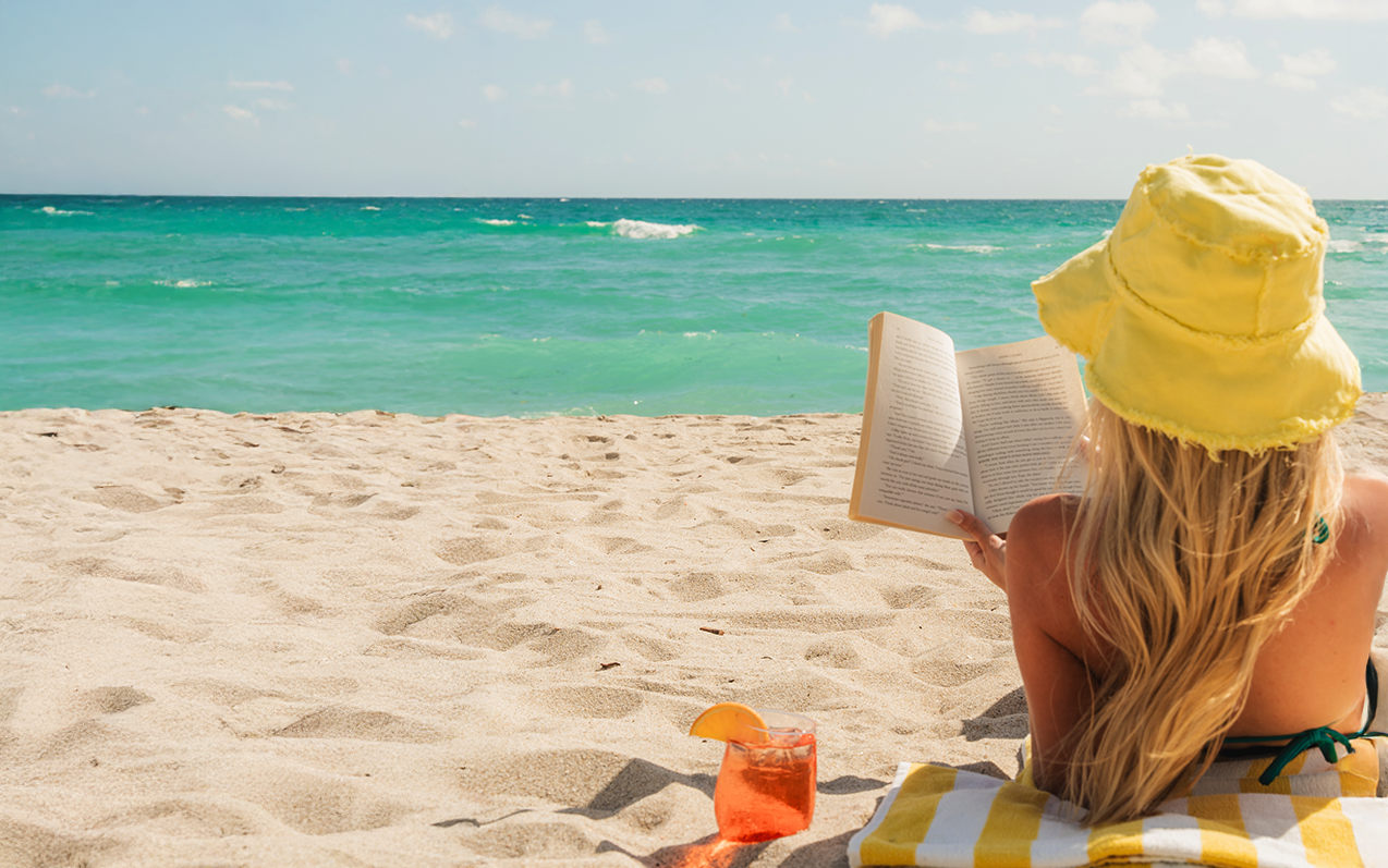 Woman reading on The Beach at The Sunny